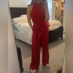 Bright red jumpsuit with bow